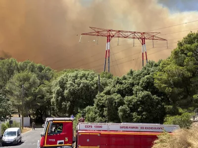 This photo provided by the fire brigade SDIS13, smoke rises during a wildfire near Marseille, southern France, Tuesday, July 8, 2025. (SDIS13 via AP)