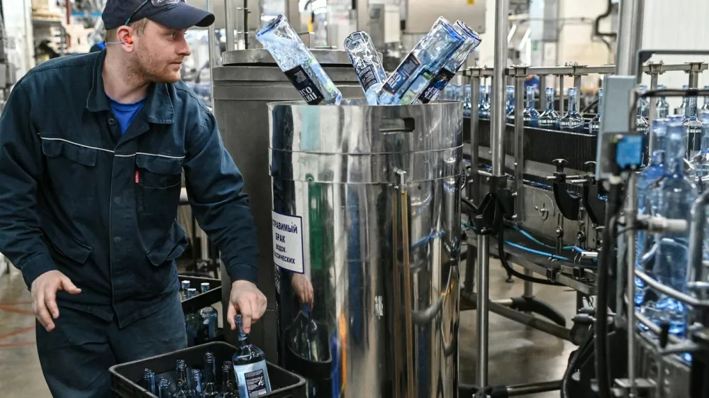 8378932 27.02.2023 Employees drain vodka from defective bottles at a production line of the Omskvinprom distillery in Omsk, Russia.,Image: 758980800, License: Rights-managed, Restrictions: Editors' note: THIS IMAGE IS PROVIDED BY RUSSIAN STATE-OWNED AGENCY SPUTNIK., Model Release: noFoto: Profimedia
