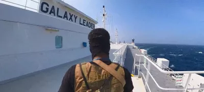 FILE PHOTO: A Houthi fighter stands on the Galaxy Leader cargo ship in the Red Sea in this photo released November 20, 2023. Houthi Military Media/Handout via REUTERS  THIS IMAGE HAS BEEN SUPPLIED BY A THIRD PARTY//File Photo