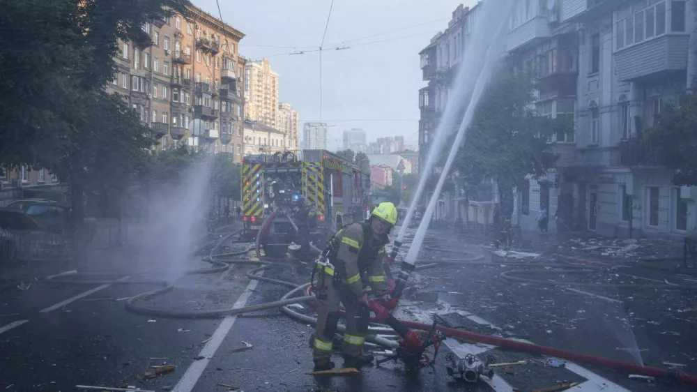 Rescue workers put out a fire of a residential house heavily damaged by a Russian strike in Kyiv, Ukraine, on Thursday, July 10, 2025. (AP Photo/Evgeniy Maloletka)