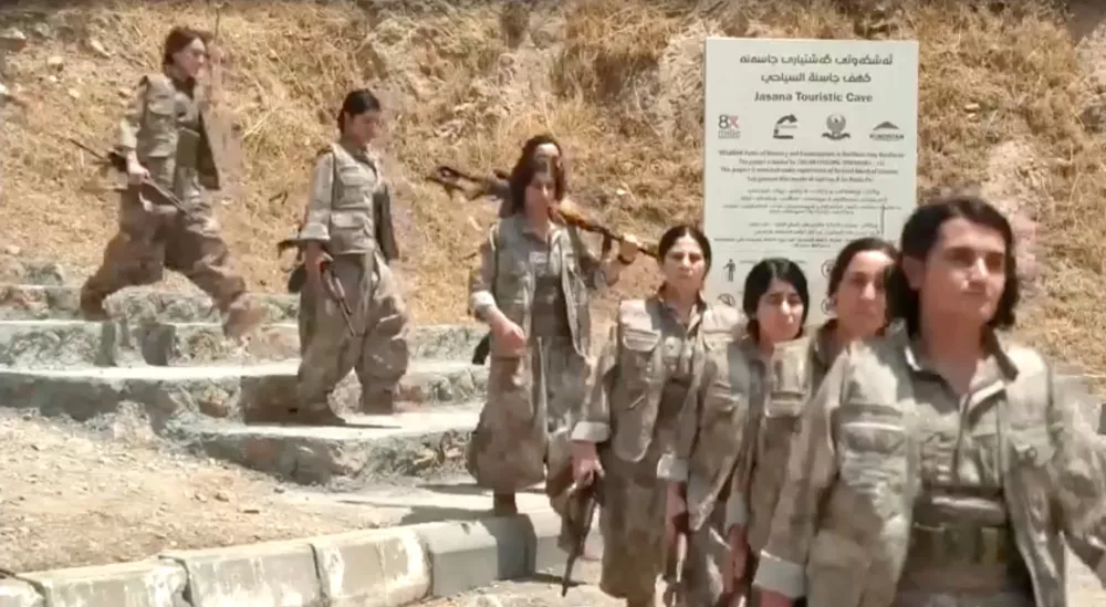 Armed PKK fighters arrive ahead of a disarming ceremony in Sulaimaniya, Iraq, July 11, 2025, in this?screengrab?obtained from a handout video. KURDISTAN WORKERS PARTY MEDIA OFFICE/Handout via REUTERS THIS IMAGE HAS BEEN SUPPLIED BY A THIRD PARTY