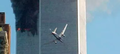 ** ADVANCE FOR TUESDAY, NOV. 4, 2008 AND THEREAFTER ** FILE ** In this Sept. 11, 2001 file photo, a jet airliner nears one of the World Trade Center towers in New York. For all of the candidates' talk about the need for change, Americans have seen plenty of it since the last time they selected a new leader - including the attack on the World trade Center in 2001. (AP Photo/Carmen Taylor/File)