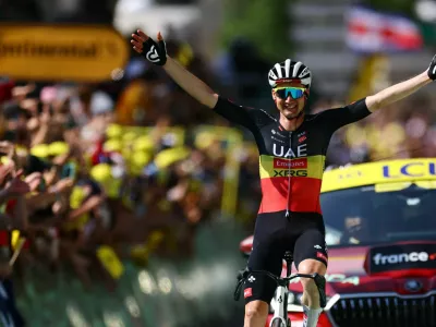 Cycling - Tour de France - Stage 15 - Muret to Carcassonne - Muret, France - July 20, 2025 UAE Team Emirates XRG's Tim Wellens celebrates as he crosses the finish line to win stage 15 REUTERS/Sarah Meyssonnier