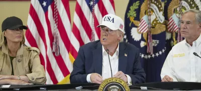 President Donald J. Trump, center, first lady Melania Trump and Texas Gov. Greg Abbott, attend a roundtable discussion at the Community Emergency Operations Center in Kerrville, Texas, Friday, July 11, 2025. (Ricardo B. Brazziell/Austin American-Statesman via AP)