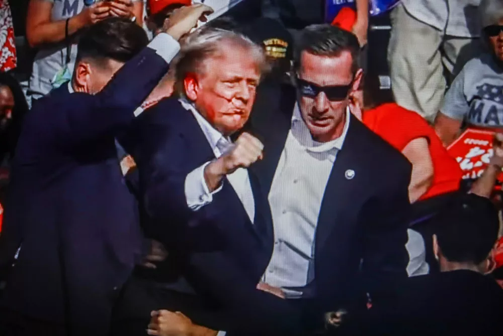 SCREENSHOT - 14 July 2024, US, Butler: Former US President Donald Trump is rushed off stage by secret service after being struck by gunfire during his Presidential Election campaign rally in Butler Pennsylvania. Photo: Artem Priakhin/SOPA Images via ZUMA Press Wire/dpa