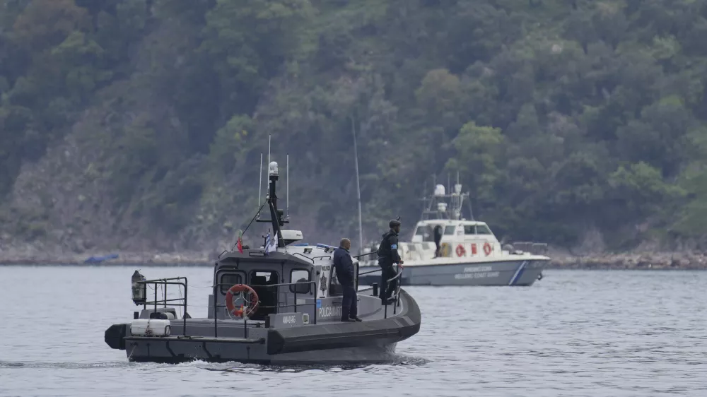 FILE- Frontex, foreground, and Greek coast guard vessels take part in a search and rescue operation, after the capsizing of a boat carrying migrants, off the coast on the northeastern Aegean Sea island of Lesbos, Greece, on April 3, 2025. (AP Photo/Panagiotis Balaskas, File)