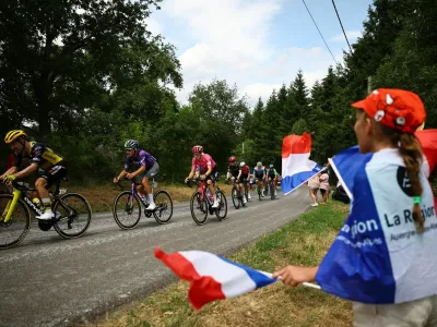 Cycling - Tour de France - Stage 10 - Ennezat to Mont-Dore - Ennezat, France - July 14, 2025 Team Visma | Lease a Bike's Victor Campenaerts, Team Jayco AlUla's Luke Plapp and EF Education - EasyPost's Neilson Powless in action with riders during stage 10 REUTERS/Sarah Meyssonnier