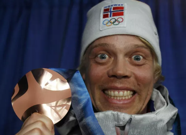 Bronze medallist Audun Groenvold of Norway poses during the medal ceremony for the men's freestyle skiing ski cross competition at the Vancouver 2010 Winter Olympics, February 21, 2010. REUTERS/Chris Helgren (CANADA)