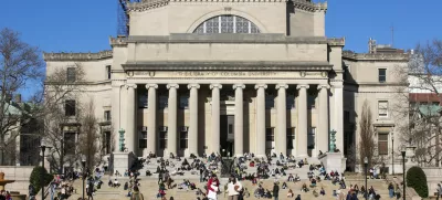 FILE - Students sit on the front steps of Low Memorial Library on the Columbia University campus in New York City, Feb. 10, 2023. (AP Photo/Ted Shaffrey, File)