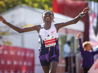 FILE - Ruth Chepngetich, from Kenya, crosses the finish line of the Chicago Marathon to win the women's professional division and break the women's marathon world record in Grant Park on Oct. 13, 2024. (Tess Crowley/Chicago Tribune via AP, file)