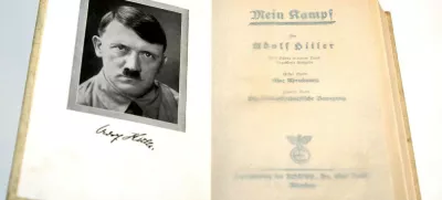(dpa) - A copy of the first edition of Adolf Hitler's 'Mein Kampf' (My Struggle) features a frontispiece of the Fuehrer, pictured in Germany, 2003. In 1923 Adolf Hitler was arrested for attempting to overthrow the government in Munich and his National Socialist German Workers' Party (the Nazi party NSDAP) was disbanded. While in prison he wrote the first volume of 'Mein Kampf', outlining his political ideas. 'Mein Kampf' was not taken seriously at first, but it includes many of the ideas the Nazis put in practice in the 1930s and 1940s.,Image: 676250941, License: Rights-managed, Restrictions:, Model Release: no