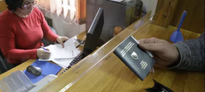 Bosnian citizen submit applications and old passport for issuing new biometric passport at police station in Sarajevo,Bosnia, on Monday, Nov. 8, 2010. European Union nations decided unanimously Monday to end visa requirements for residents of Bosnia and Albania by mid-December.The move by the EU Interior Ministers came despite fears that it will increase the number of unfounded asylum requests in the EU from the two nations. (AP Photo/Amel Emric)