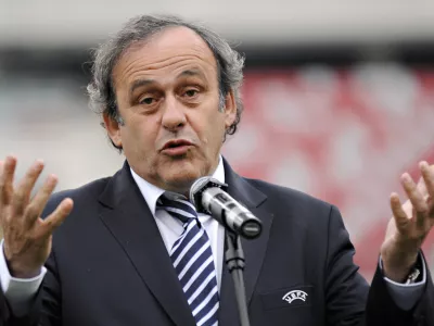 FILE - In this April 12, 2012 UEFA President Michel Platini speaks to journalists during a press conference at the National Stadium in Warsaw. The 2020 European Championship could be hosted by 12 or 13 cities across Europe in a potentially radical change to the world's second biggest football tournament, UEFA President Michel Platini said on Saturday, June 30, 2012. Held every four years, the European Championship is second only to the World Cup in global popularity and until 12 years ago was staged in one nation. (AP Photo/Alik Keplicz, File)