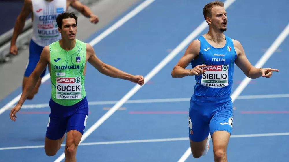 Athletics - European Athletics Championships - Stadio Olimpico, Rome, Italy - June 10, 2024 Slovenia's Matic Ian Gucek and Italy's Alessandro Sibilio during the men's 400m hurdles semi final REUTERS/Aleksandra Szmigiel