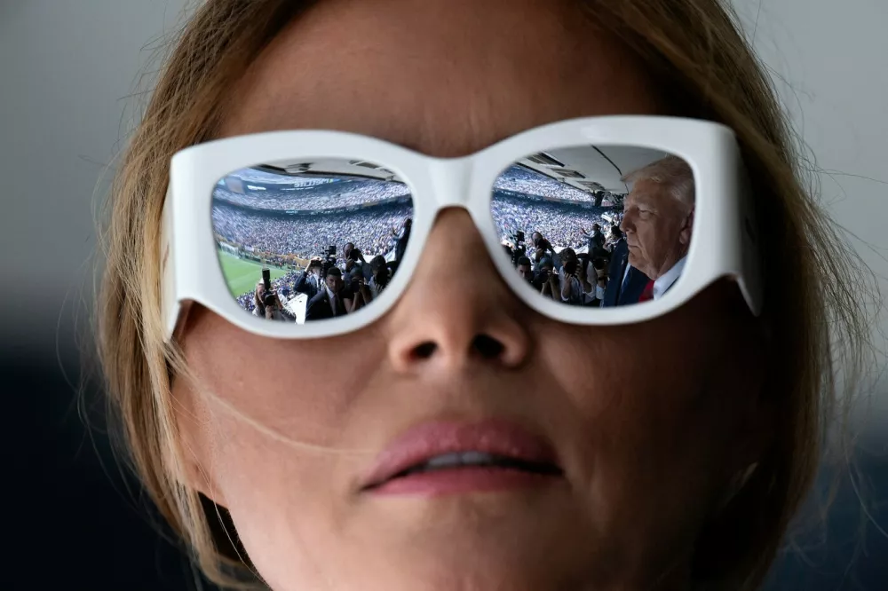 US President Donald Trump is reflected in First Lady Melania Trump's sunglasses as they attend the 2025 FIFA Club World Cup final football match between England's Chelsea and France's Paris Saint-Germain at MetLife Stadium in East Rutherford, New Jersey, on July 13, 2025.,Image: 1021667823, License: Rights-managed, Restrictions:, Model Release: no