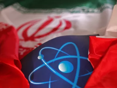 FILE PHOTO: Atomic symbol and Iranian flag are seen in this illustration taken September 8, 2022. REUTERS/Dado Ruvic/Illustration/File Photo