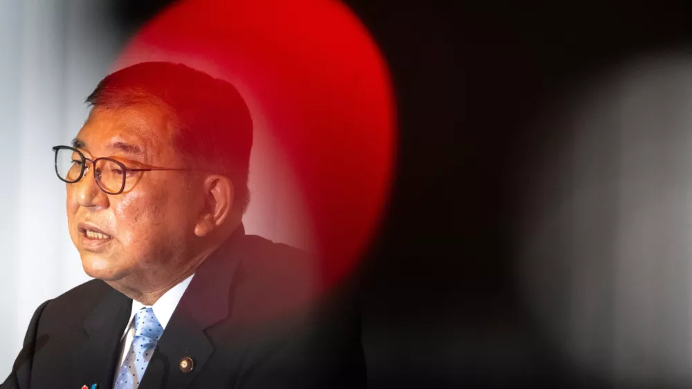 Japan's Prime Minister Shigeru Ishiba attends a press conference at the headquarters of the Liberal Democratic Party (LDP) in Tokyo Monday, July 21, 2025 after the prime minister's ruling coalition failed to secure a majority in the upper house in a parliamentary election. (Philip Fong/Pool Photo via AP) 