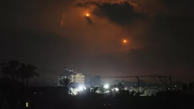 Illumination flares launched by the Israeli army are seen over Deir al-Balah in central Gaza Strip Monday, July 21, 2025. (AP Photo/Abdel Kareem Hana)
