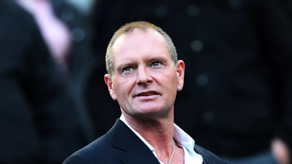 FILE - In this Sunday, Oct. 16, 2011 file photo, Paul Gascoigne, is seen in the stands ahead of the English Premier League soccer match between Newcastle United and Tottenham Hotspurs at St James' Park, Newcastle, England. Paul Gascoigne's appearance at a charity event, with his hands shaking uncontrollably and a stream of swear words tumbling out of his mouth, has sparked renewed fears about the health of one of England's most talented and popular footballers, with some are even saying his life is in danger. Gordon Taylor, chief executive of the Professional Footballer's Association, said Monday, Feb. 4, 2013, that "he sounds as if he needs almost a 24-hour watching brief at the moment." (AP Photo/Scott Heppell, File)