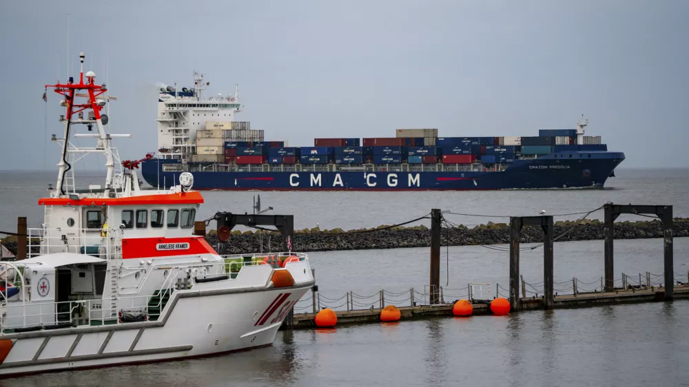 CMA CGM PREGOLIA, container freighter flying the flag of Malta, in the Elbe estuary, rescue cruiser, ANNELIESE KRAMER, in harbour, Cuxhaven, Lower Saxony, Germany, Europe,Image: 892175615, License: Rights-managed, Restrictions:, Model Release: no
