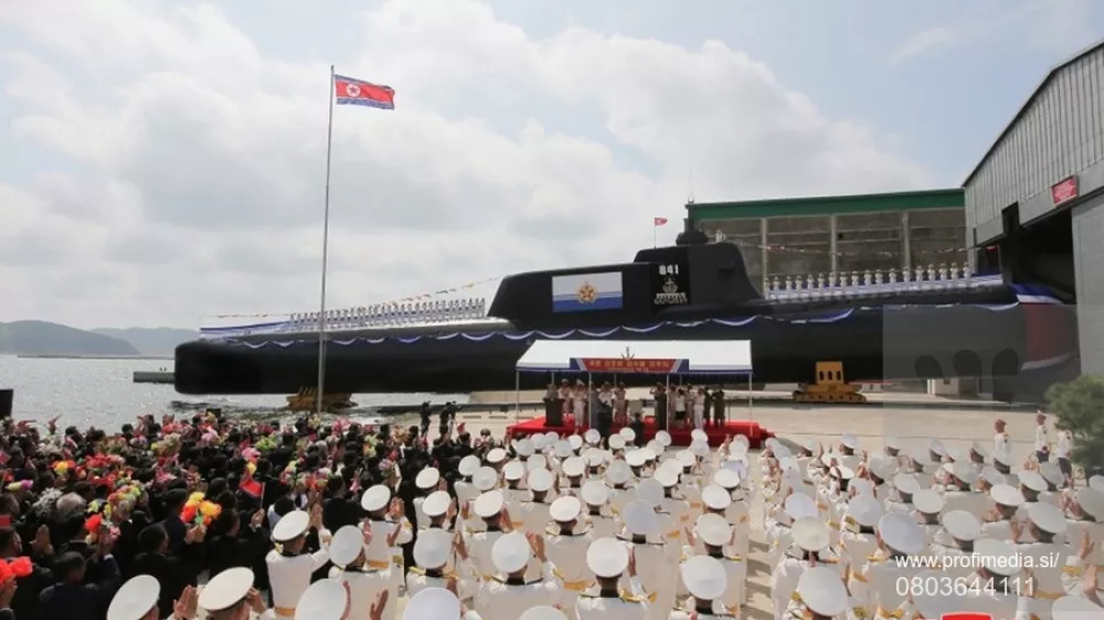This image, released on September 8, 2023, by the North Korean Official News Service (), shows North Korean leader Kim Jong Un during the launch of the country's first tactical nuclear attack submarine at Sinpho shipyard. According to state media, the tactical nuclear attack submarine, No. 841, the first of its kind, was transferred to the East Sea Fleet of the KPA Navy and named the "Hero Kim Kun Ok." Photo by /UPI,Fotografija:803644111, Licenca:Rights-managed, Omejitve:, Model izdaje:no