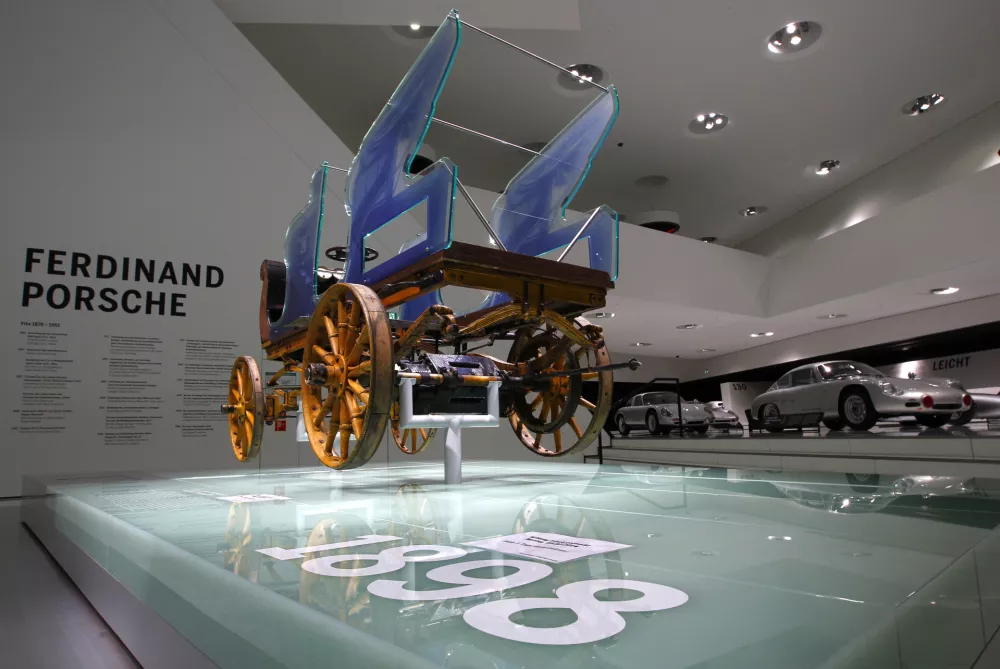 The world's very first Porsche from 1898 "Egger-Lohner-Elektromobil Modell C.2 Phaeton (P1)" is displayed at the museum of German sports car manufacturer Porsche in Stuttgart February 6, 2014. The vehicle was designed and built by Ferdinand Porsche in 1898 and has a top speed by 35 km per hour. Picture taken on February 6, 2014. REUTERS/Michaela Rehle (GERMANY - Tags: BUSINESS TRANSPORT)