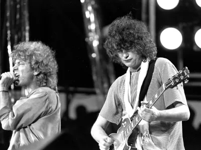 FILE - In this July 13, 1985 file photo, singer Robert Plant, left, and guitarist Jimmy Page of the British rock band Led Zeppelin perform at the Live Aid concert at Philadelphia's J.F.K. Stadium. Generations of aspiring guitarists have tried to copy the riff from Led Zeppelin's &acirc;&euro;śStairway to Heaven.&acirc;&euro;ť Starting Tuesday, June 14, 2016, a Los Angeles court will try to decide whether the members of Led Zeppelin themselves ripped off that riff. Page and Plant are named as defendants in the lawsuit brought by the trustee of late guitarist Randy Wolfe from the band Spirit. (AP Photo/Rusty Kennedy, File)
