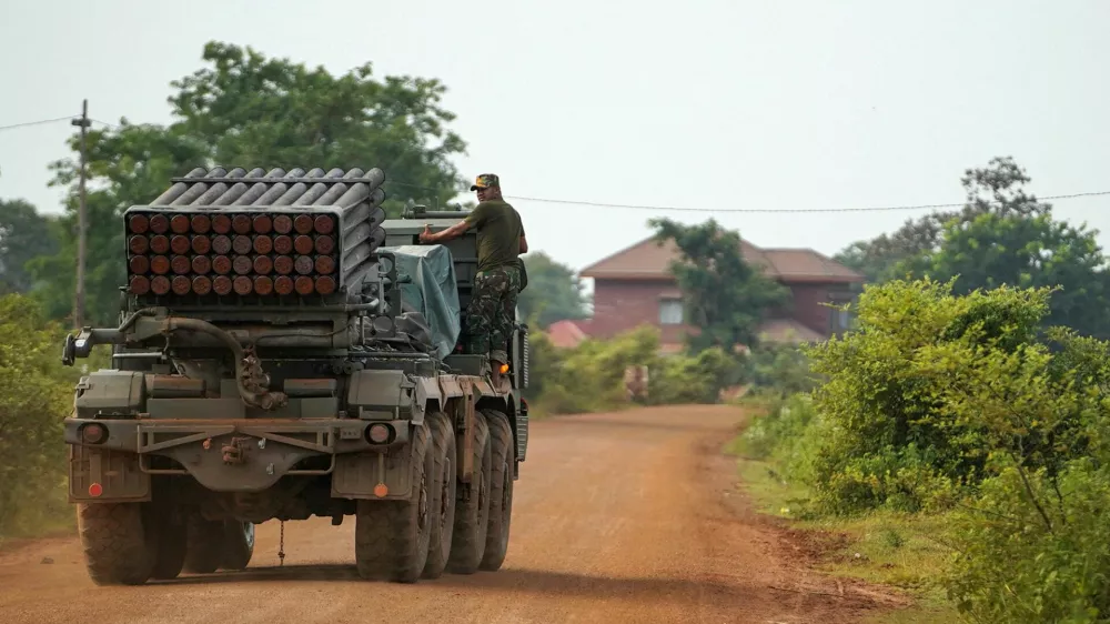 A Cambodian military personnel stands on a BM-21 Grad multiple rocket launcher, around 40 km (24 miles) from the disputed Ta Moan Thom temple, after Thailand and Cambodia exchanged heavy artillery on Friday as their worst fighting in more than a decade stretched for a second day, in Oddar Meanchey province, Cambodia, July 25, 2025. REUTERS/Soveit Yarn   TPX IMAGES OF THE DAY