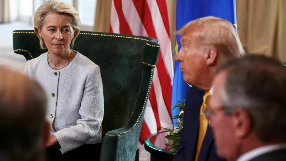 FILE PHOTO: European Commission President Ursula von der Leyen sits with U.S. President Donald Trump, after the announcement of a trade deal between the U.S. and EU, in Turnberry, Scotland, Britain, July 27, 2025. REUTERS/Evelyn Hockstein/File Photo
