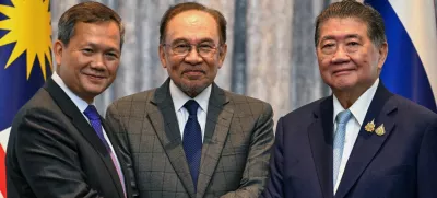 Cambodia's Prime Minister Hun Manet, Malaysia's Prime Minister Anwar Ibrahim and Thailand's acting Prime Minister Phumtham Wechayachai shake hands as they pose for photos following a press conference, on the day of mediation talks on the Thailand–Cambodia border conflict, in Putrajaya, Malaysia July 28, 2025.  Mohd Rasfan/Pool via REUTERS