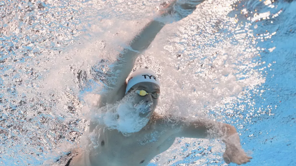 Leon Marchand of France competes in the men's 200-meter individual medley final at the World Aquatics Championships in Singapore, Thursday, July 31, 2025. (AP Photo/Lee Jin-man)