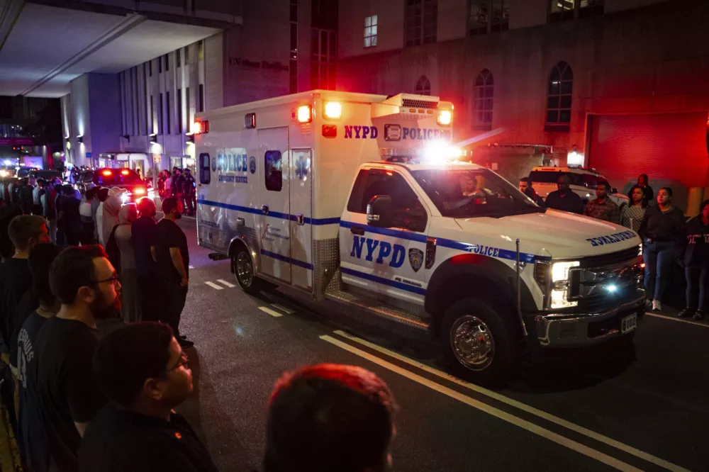The ambulance carrying the body of Didarul Islam exits NewYork-Presbyterian/Weill Cornell Medical Hospital during the dignified transfer of the slain officer, who was shot and killed by a gunman earlier this evening, early Tuesday, July 29, 2025, in New York. (AP Photo/Angelina Katsanis)