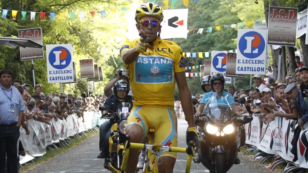 Spanish cyclist for the Astana team, Alberto Contador crosses the finish line to win the Criterium International de Castillon cycling classic in Castillon-la-Bataille, southwestern France, Tuesday, Aug. 3, 2010. Three-time winner of the Tour de France, Contador, has decided to join Bjarne Riis's Team Saxo Bank on a two-year deal. (AP Photo/Bob Edme)