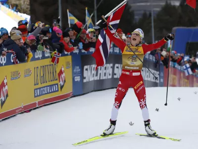 Norway's Therese Johaug wins the 10km women's mass start race of the Tour de Ski cross country, in Val di Fiemme, Italy, Sunday, Jan. 5, 2025. (AP Photo/Alessandro Trovati)