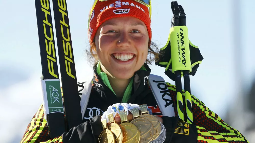 Biathlon - IBU World Championships - Women 12.5 km Mass Start - Hochfilzen, Austria - 19/2/17 - Laura Dahlmeier of Germany displays her medals.  REUTERS/Leonhard Foeger TPX IMAGES OF THE DAY