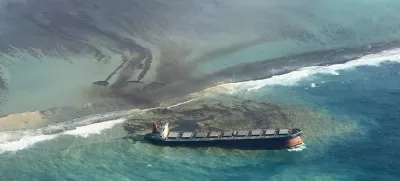 This photo taken and provided by Eric Villars shows oil leaking from the MV Wakashio, a bulk carrier ship that recently ran aground off the southeast coast of Mauritius, Friday, Aug. 7, 2020. Anxious residents of the Indian Ocean island nation of Mauritius are stuffing fabric sacks with sugar cane leaves to create makeshift oil spill barriers as tons of fuel leak from a grounded ship. The government has declared an environmental emergency and France says it is sending help from its nearby Reunion island. (Eric Villars via AP)