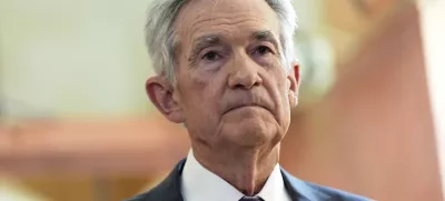 FILE - Federal Reserve Chairman Jerome Powell listens as President Donald Trump visits the Federal Reserve, Thursday, July 24, 2025, in Washington. (AP Photo/Julia Demaree Nikhinson, File)