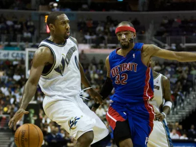 Washington Wizards' Gilbert Arenas, left, is guarded by Detroit Pistons' Richard Hamilton (32) during the second half of an NBA basketball game, Saturday, March 28, 2009, in Washington. The Pistons won 98-96. (AP Photo/Manuel Balce Ceneta)