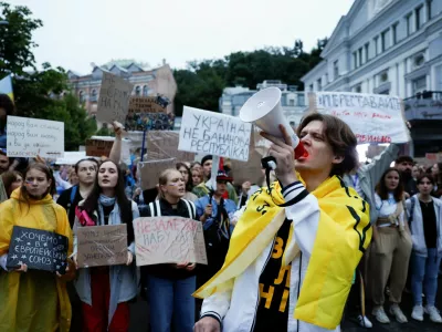 A protester uses a megaphone during a rally ahead of a vote in parliament on Thursday, in which lawmakers will consider restoring the independence of two key anti-corruption agencies, amid Russia's attack on Ukraine, in Kyiv, Ukraine, July 30, 2025. REUTERS/Thomas Peter