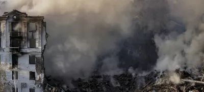 Smoke rises over a residential building destroyed by a Russian air strike on Kramatorsk, Ukraine, on Thursday, July 31, 2025. (AP Photo/Yevhen Titov)