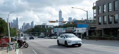 FILE PHOTO: A Tesla robotaxi drives on the street along South Congress Avenue in Austin, Texas, U.S., June 22, 2025. REUTERS/Joel Angel Juarez/File Photo
