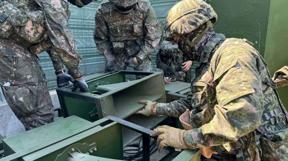 FILE PHOTO: South Korean soldiers work on a loudspeaker that is set up for propaganda broadcasts during a military drill near the demilitarized zone separating the two Koreas in Paju, South Korea, in this handout picture provided by the Defense Ministry and released on June 9, 2024.  The Defense Ministry/Handout via REUTERS  ATTENTION EDITORS - THIS IMAGE HAS BEEN SUPPLIED BY A THIRD PARTY./File Photo