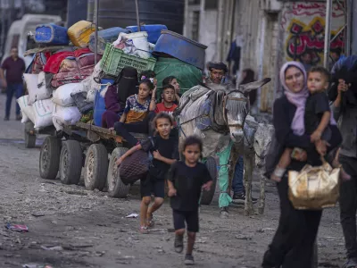 Displaced Palestinians flee Jabalia after the Israeli army issued evacuation orders in Gaza City, June 29, 2025. (AP Photo/Jehad Alshrafi)