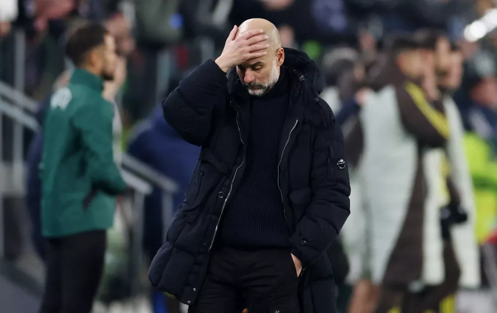 Soccer Football - Champions League - Juventus v Manchester City - Allianz Stadium, Turin, Italy - December 11, 2024 Manchester City manager Pep Guardiola reacts at the end of the match REUTERS/Claudia Greco