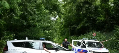 Police France, francija, policija, french police, francoska policijaPolice cars are parked in front of a cordoned-off area, near a sports field where a 32-year-old man was found dead with his throat slit and gutted, in Pont-de-Metz on August 4, 2025. The victim had stab wounds to the neck and back and has been found by a walker in a cross position, police told AFP.,Image: 1027676326, License: Rights-managed, Restrictions:, Model Release: no