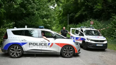 Police France, francija, policija, french police, francoska policijaPolice cars are parked in front of a cordoned-off area, near a sports field where a 32-year-old man was found dead with his throat slit and gutted, in Pont-de-Metz on August 4, 2025. The victim had stab wounds to the neck and back and has been found by a walker in a cross position, police told AFP.,Image: 1027676326, License: Rights-managed, Restrictions:, Model Release: no