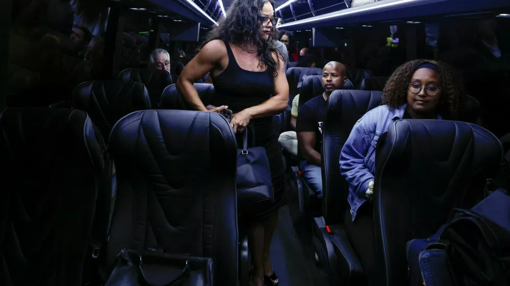 Democratic lawmakers from Texas sit inside a bus following a press conference with Illinois Governor J.B. Pritzker, after leaving their state to deny Republicans the quorum needed to redraw the state's 38 congressional districts, in Carol Stream, Illinois, U.S., August 3, 2025. REUTERS/Kamil Krzaczynski