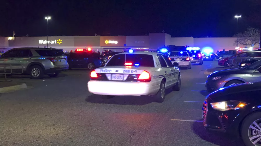 In this image from video Virginia police respond to the scene of a fatal shooting at a Walmart on Tuesday night, Nov. 22, 2022, in Chesapeake, Va. (WAVY-TV 10 via AP)