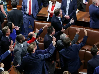 Members of the U.S. House of Representatives react after the U.S. President Donald Trump's sweeping spending and tax bill passes, on Capitol Hill in Washington, D.C., U.S., July 3, 2025. REUTERS/Umit Bektas