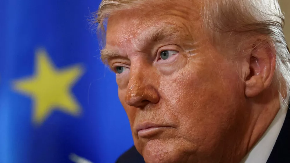 FILE PHOTO: U.S. President Donald Trump looks on during a meeting with European Commission President Ursula von der Leyen (not pictured), after an announcement of a trade deal between the U.S. and EU, in Turnberry, Scotland, Britain, July 27, 2025. REUTERS/Evelyn Hockstein/File Photo